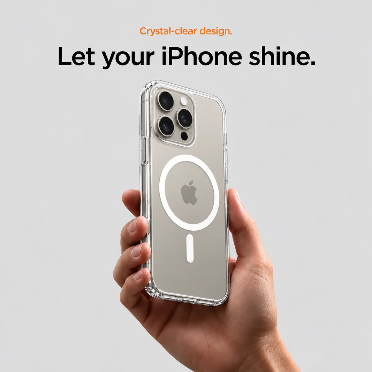 Clear magnetic phone case held at an angle, showing its transparent back and camera openings. #iPhone Model_iPhone 15 Pro Max