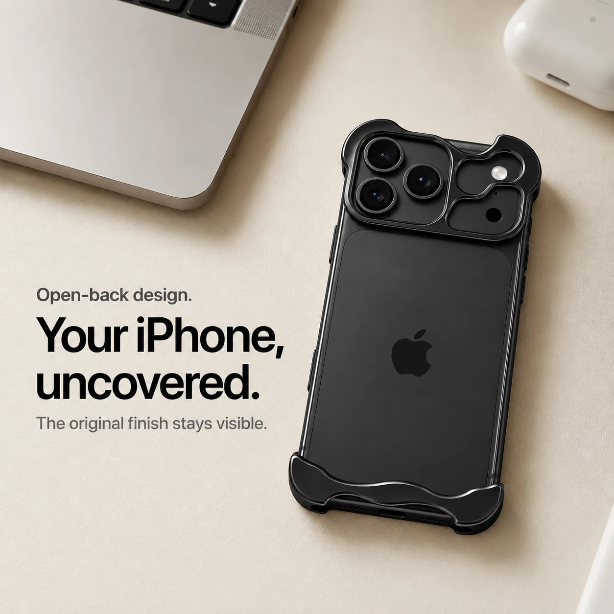 Black sculpted metal phone case on a desk showing the open back #color_Midnight Black