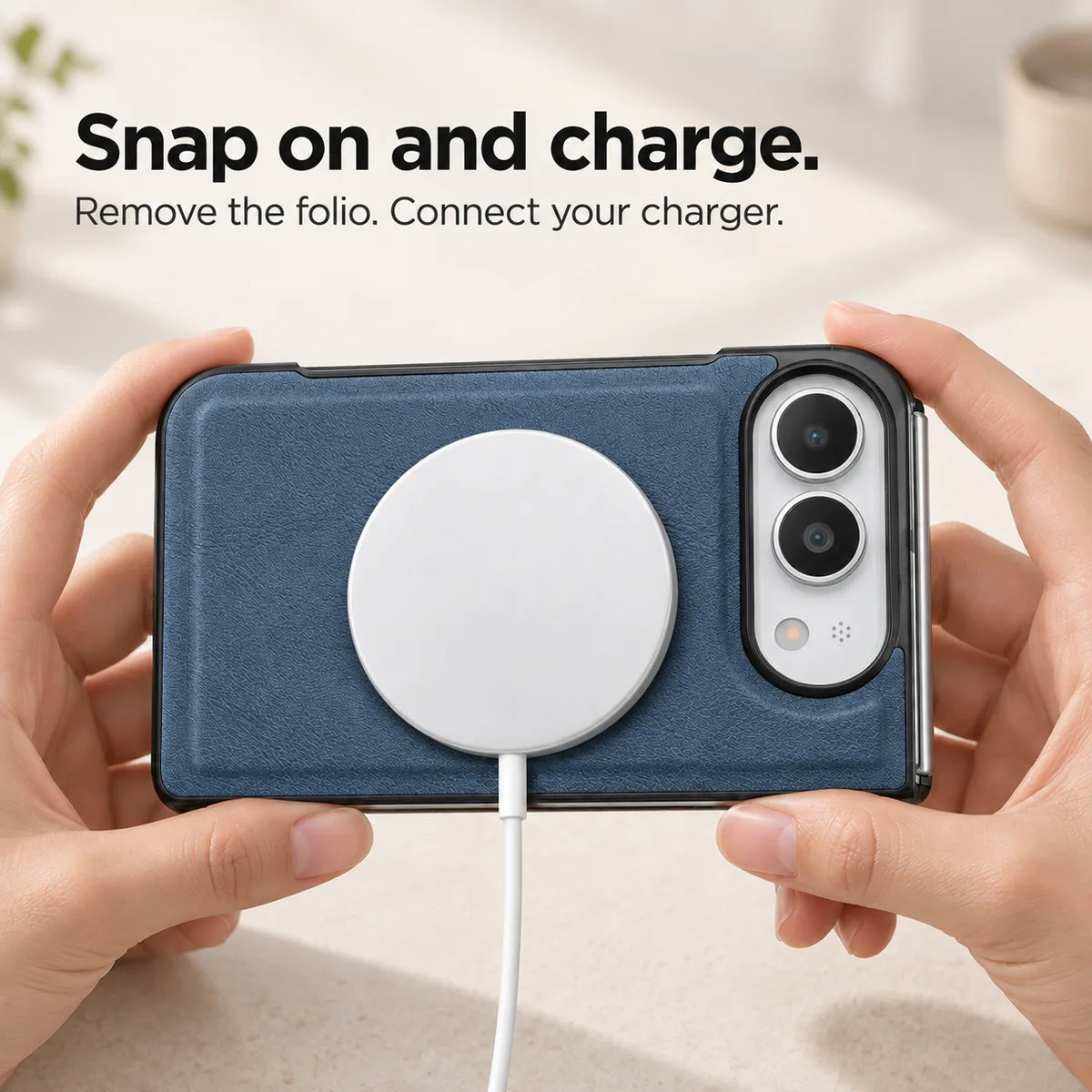 Sapphire Blue phone case held horizontally with a magnetic charging puck attached to the rear. #color_Sapphire Blue