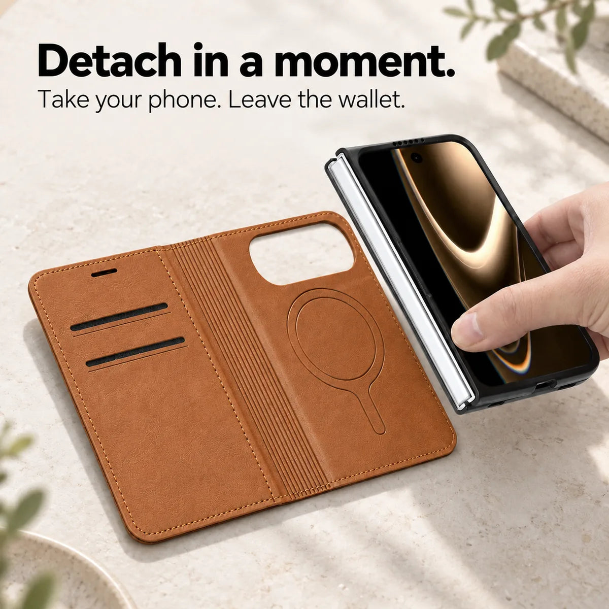 Phone and fitted case being lifted away from the open Saddle Brown magnetic wallet folio. #color_Saddle Brown