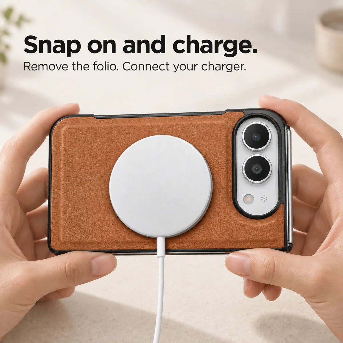 Saddle Brown phone case held horizontally with a magnetic charging puck attached to the rear. #color_Saddle Brown
