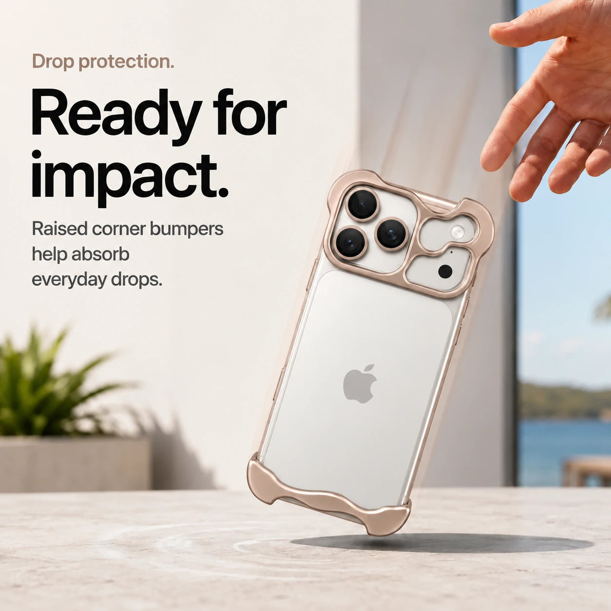 Champagne gold sculpted metal phone case demonstrating raised corner protection during a drop #color_Champagne Gold