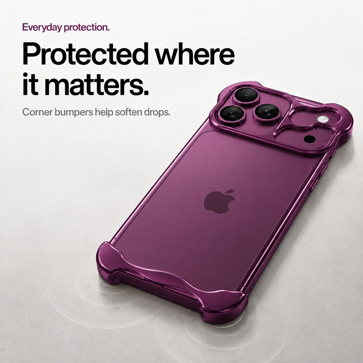 Dark purple sculpted metal phone case on a desk showing its protective corner bumpers #color_Dark Cherry