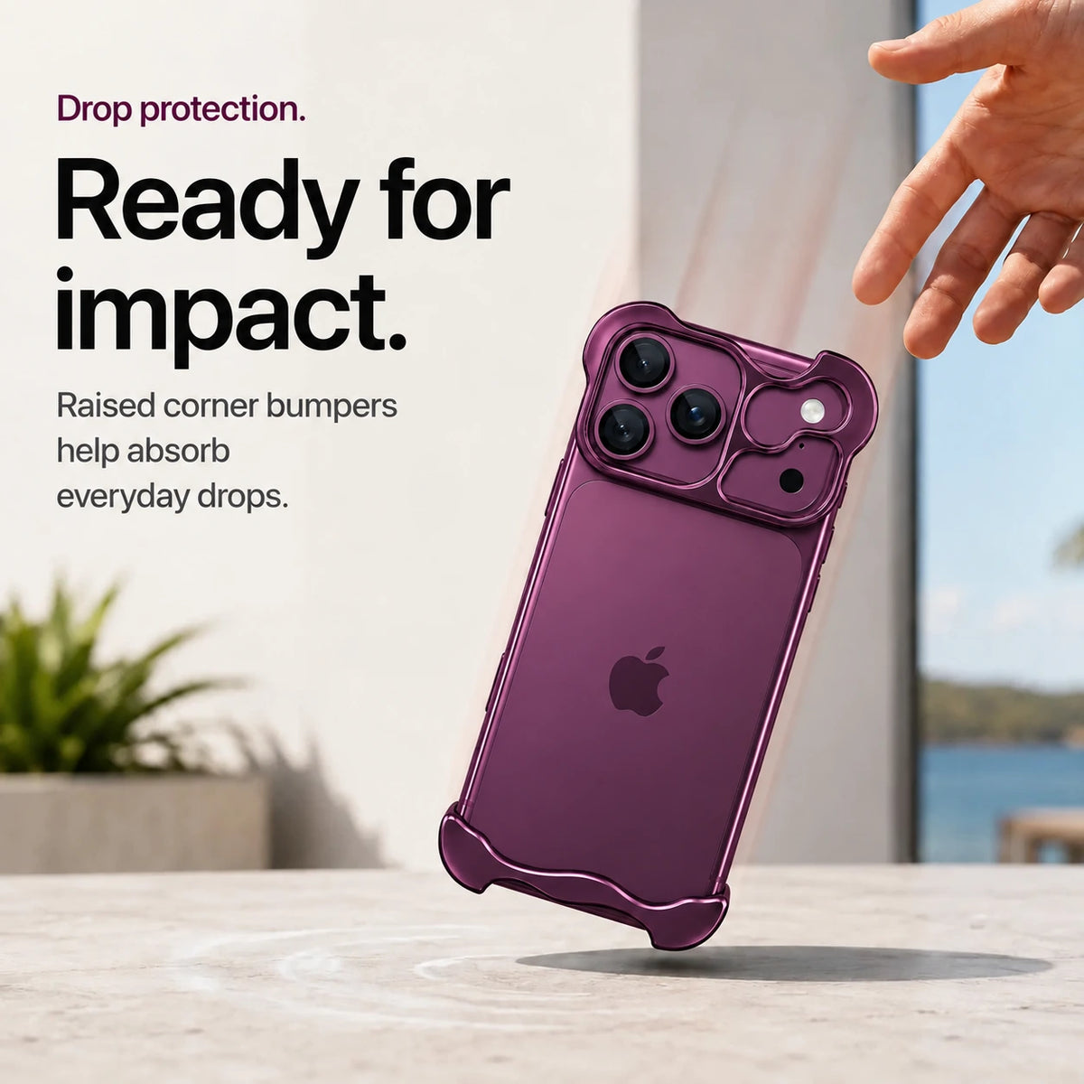 Dark purple sculpted metal phone case demonstrating raised corner protection during a drop #color_Dark Cherry