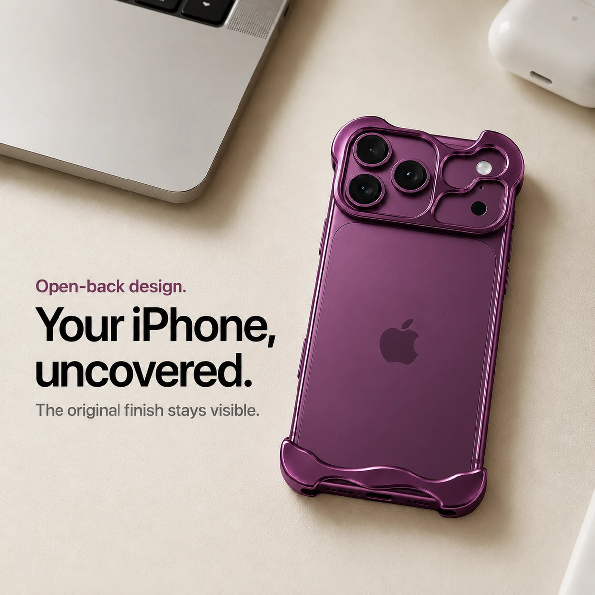 Dark purple sculpted metal phone case on a desk showing the open back #color_Dark Cherry