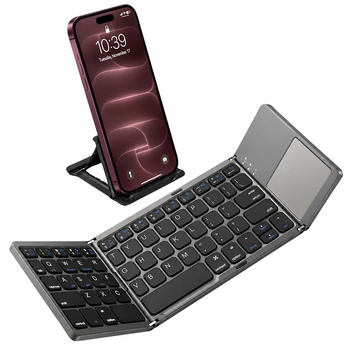 Titanium Gray folding Bluetooth keyboard with touchpad beside a Burgundy iPhone on a separate stand. #color_Titanium Gray