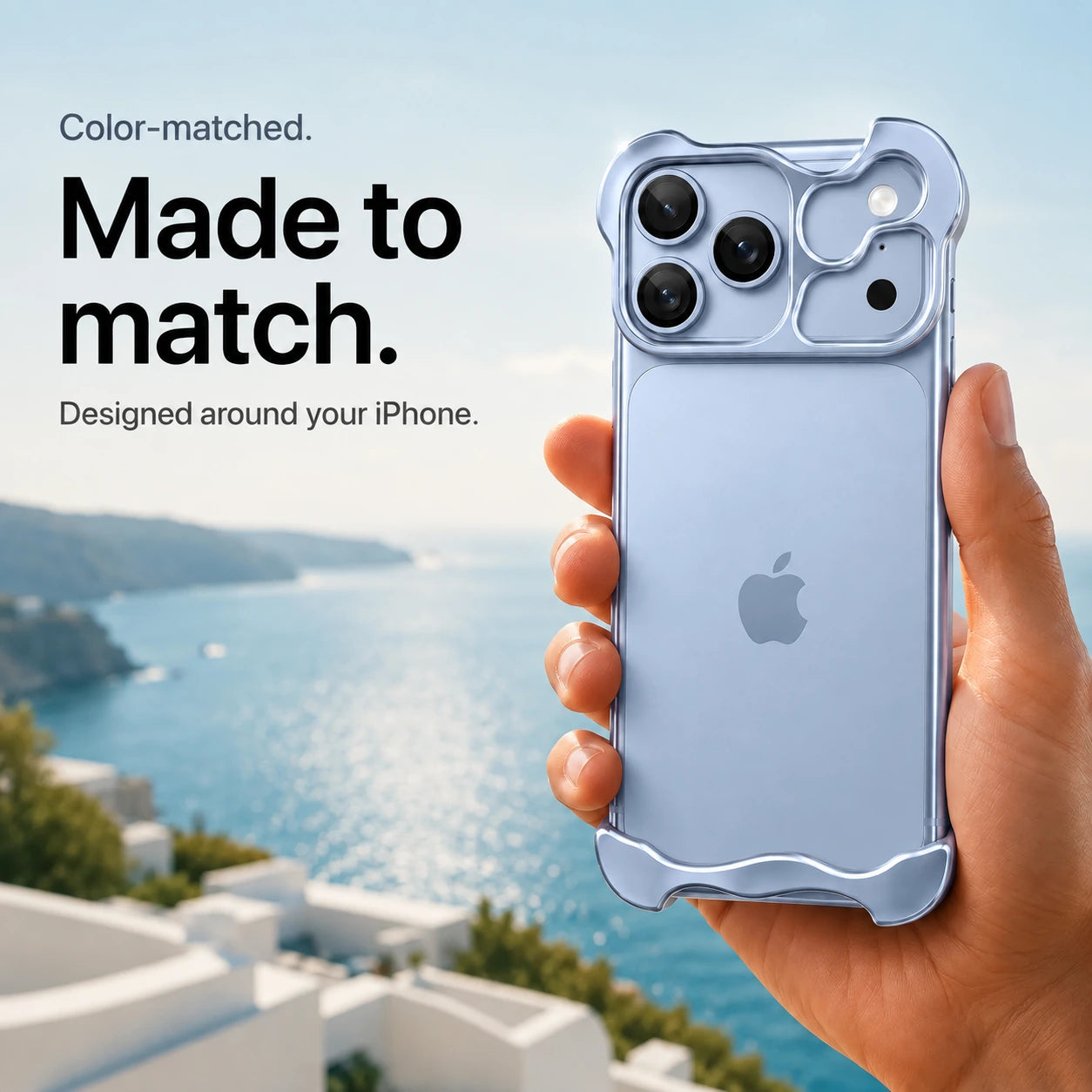 Light blue sculpted metal phone case held in a hand above a coastal background #color_Light Blue