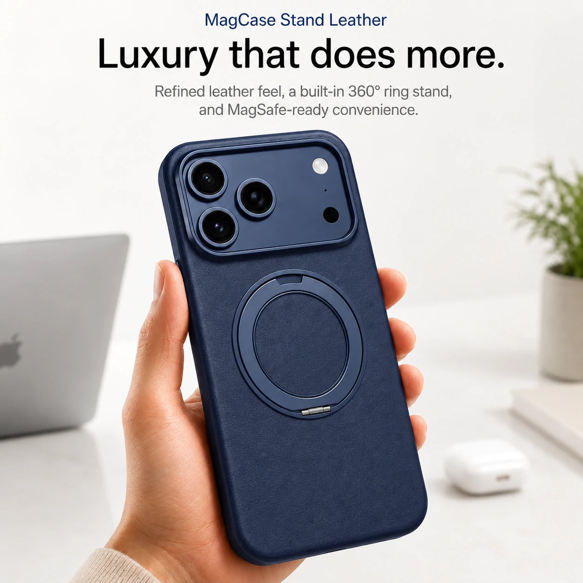 Navy blue leather phone case held upright at a desk with the ring stand folded flat #color_Deep Blue