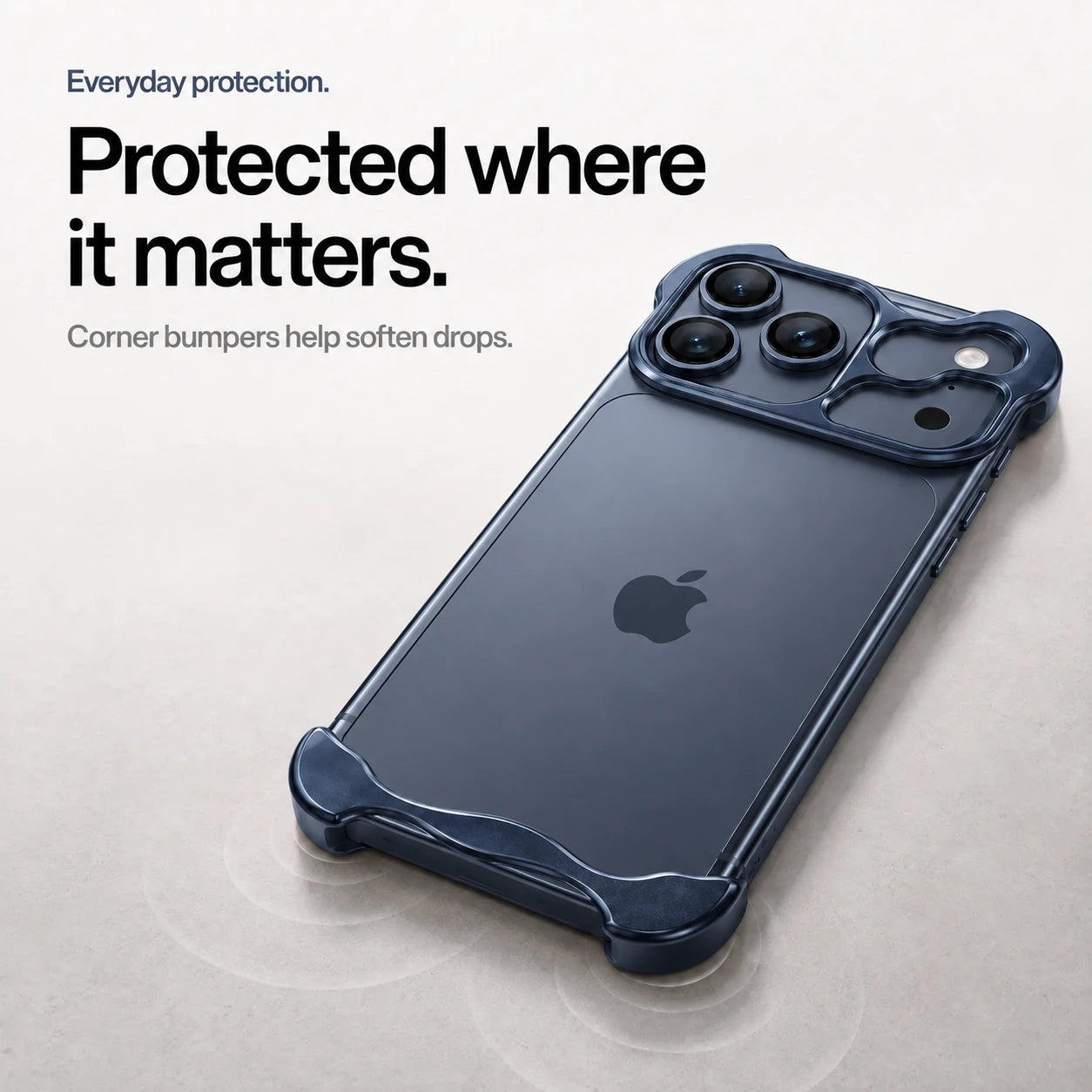 Navy blue sculpted metal phone case on a desk showing its protective corner bumpers #color_Deep Blue