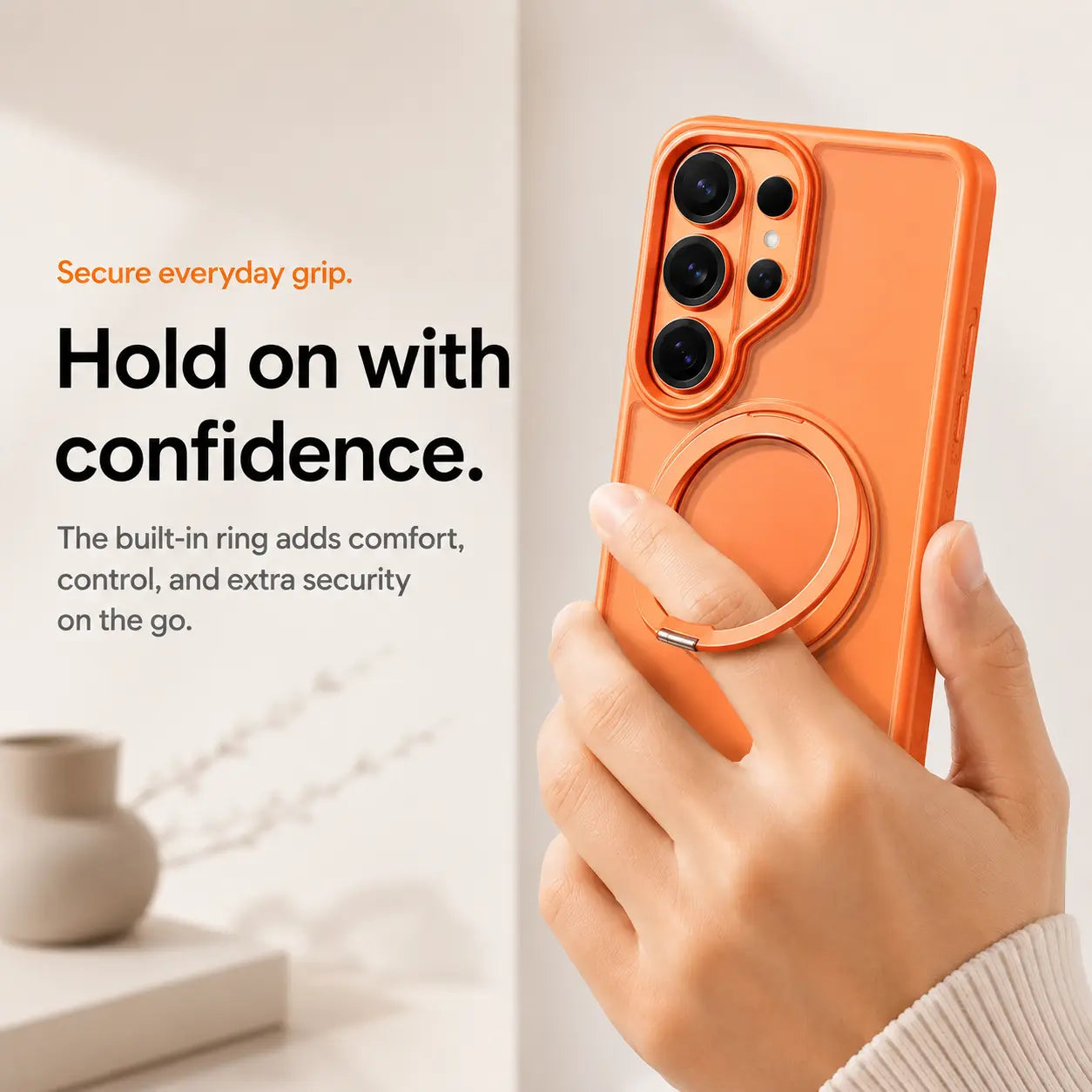 Orange magnetic phone case held using its integrated ring grip #color_Cosmic Orange