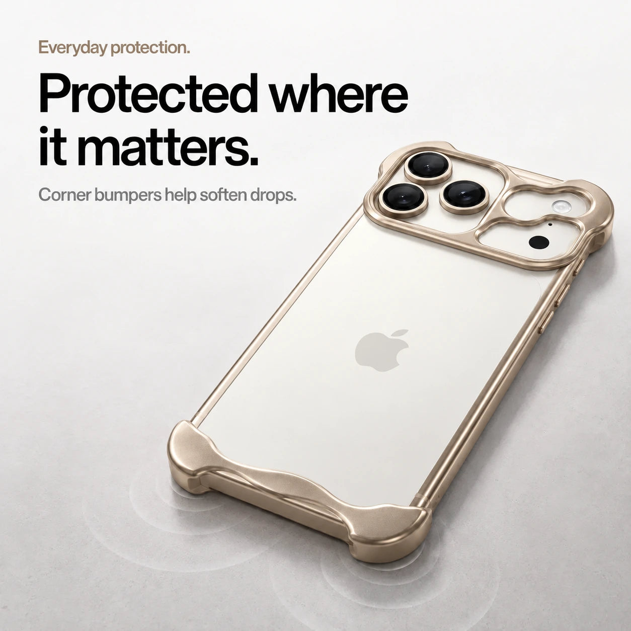 Sand gold sculpted metal phone case on a desk showing its protective corner bumpers #color_Desert Gold