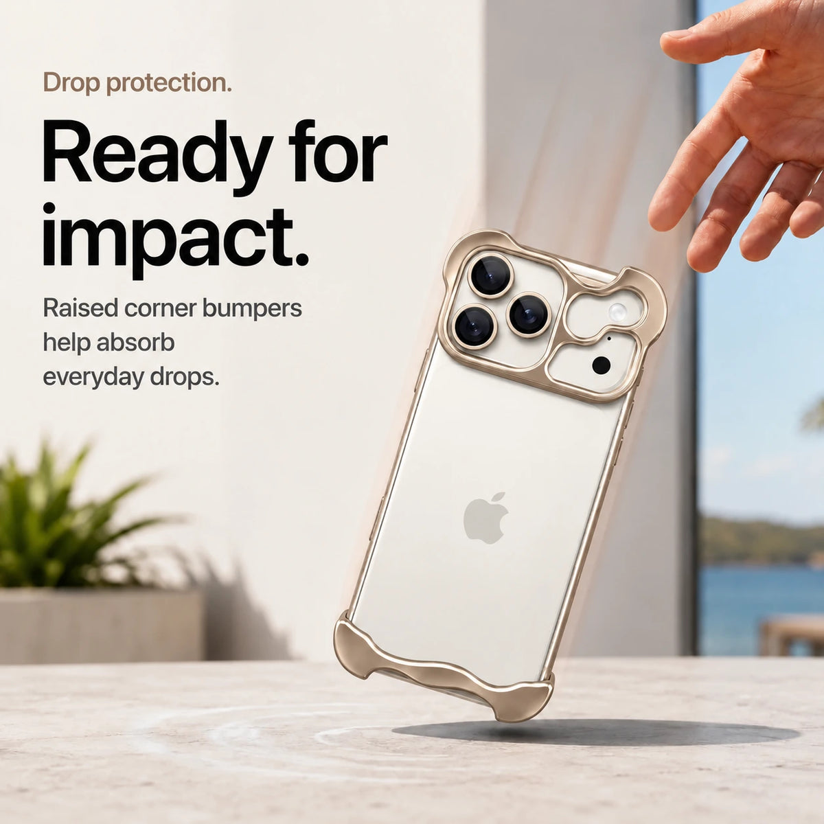 Sand gold sculpted metal phone case demonstrating raised corner protection during a drop #color_Desert Gold