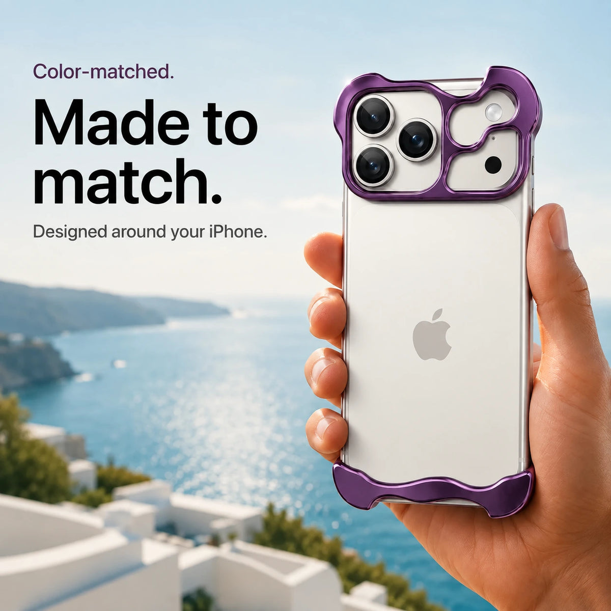 Violet sculpted metal phone case held in a hand above a coastal background #color_Lavender Purple
