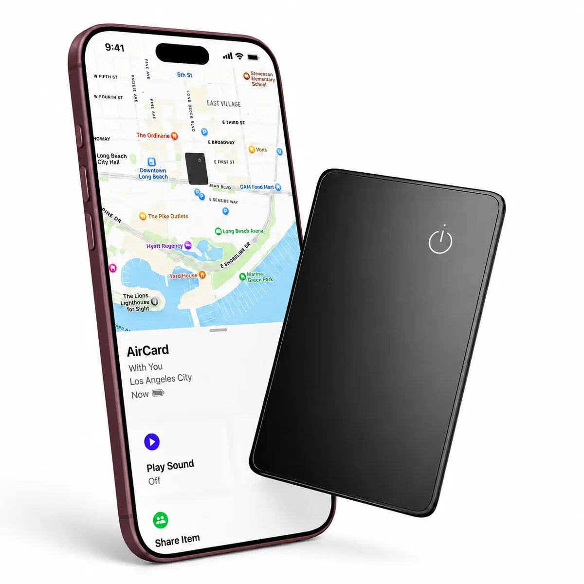 Black AirCard wallet tracker beside a Burgundy iPhone showing its location in Find My.