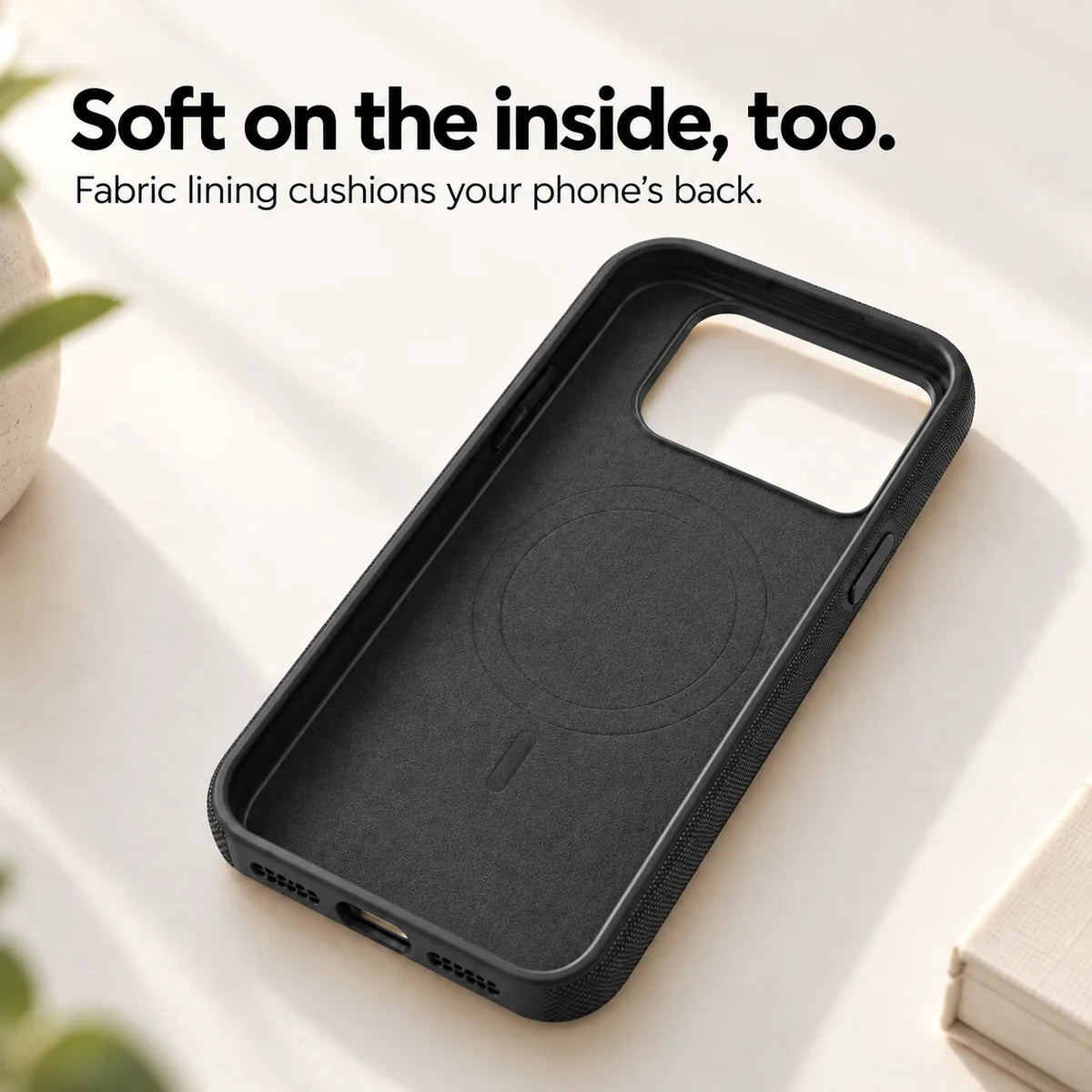 Soft fabric lining inside an empty Midnight Black phone case. #color_Midnight Black