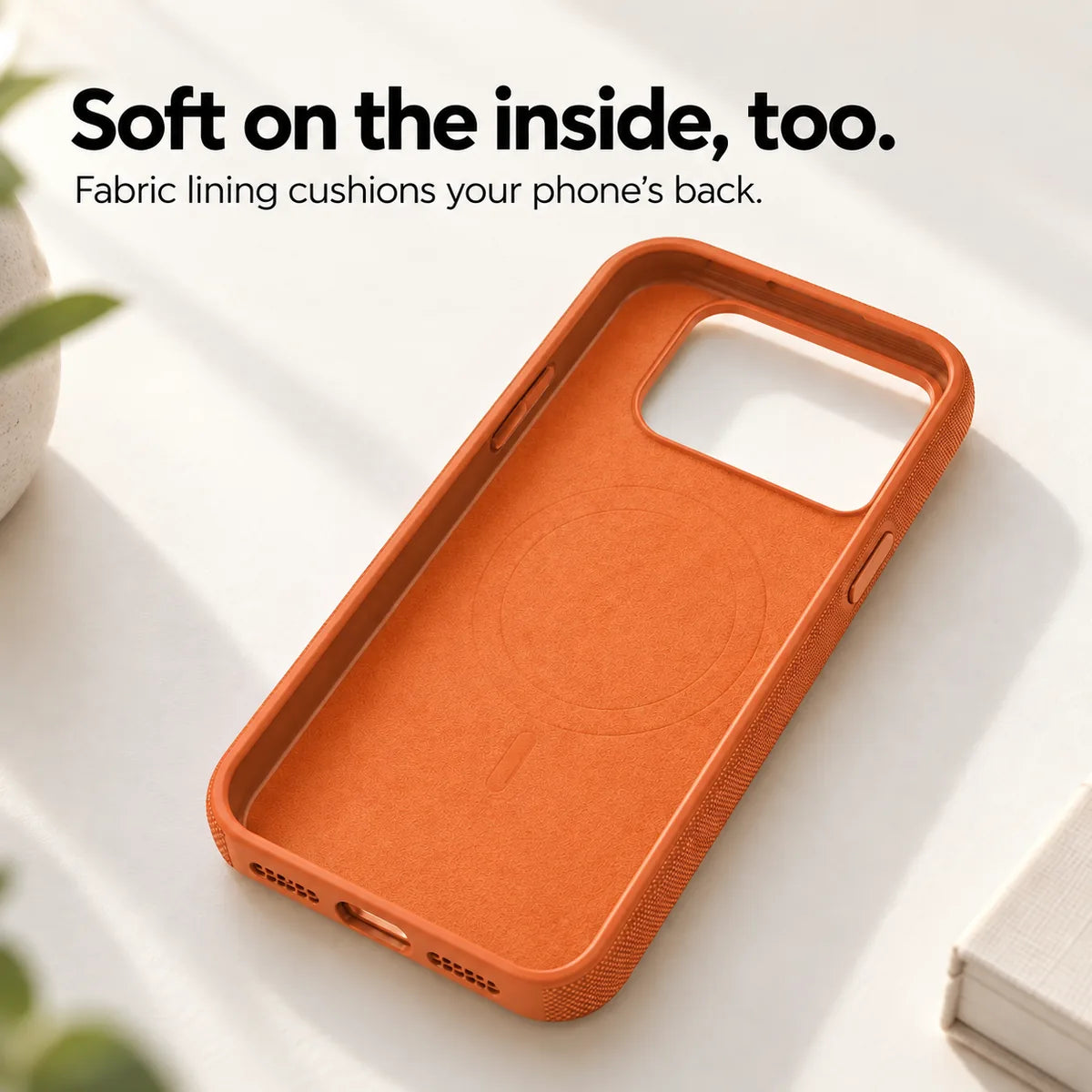 Soft fabric lining inside an empty Cosmic Orange phone case. #color_Cosmic Orange